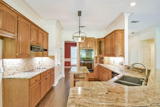 kitchen with stovetop, sink, kitchen peninsula, double oven, and light stone countertops