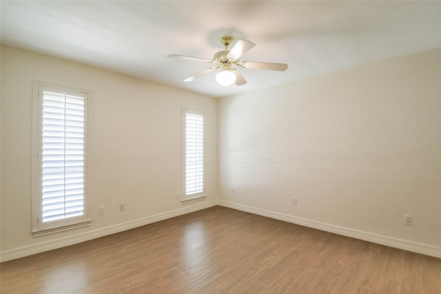 unfurnished room featuring hardwood / wood-style floors and ceiling fan