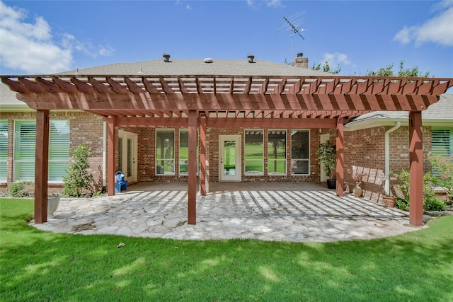 back of house with a yard, a pergola, and a patio area