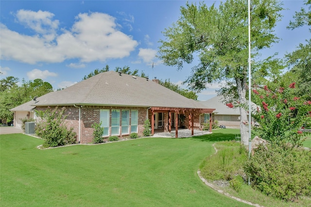 back of house with cooling unit, a lawn, and a patio