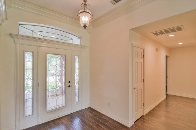 foyer featuring crown molding and hardwood / wood-style floors