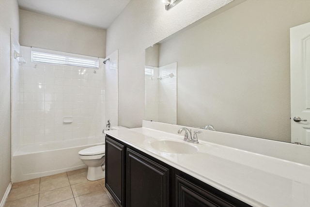 full bathroom with tile patterned floors, toilet, vanity, and tiled shower / bath