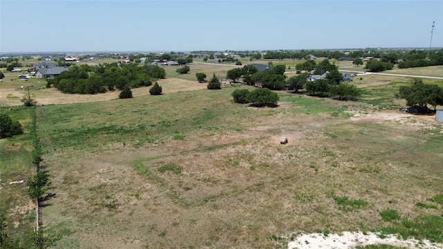 birds eye view of property featuring a rural view