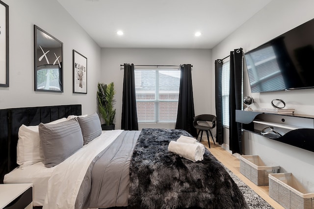 bedroom with light wood-type flooring