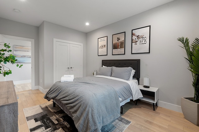 bedroom with a closet and light wood-type flooring