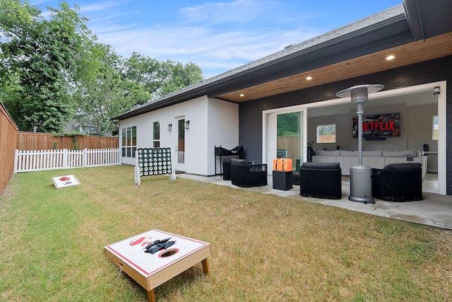 rear view of property with a patio area and a lawn