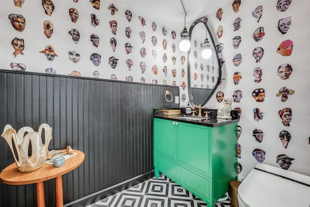 bathroom with tile patterned flooring, toilet, and vanity