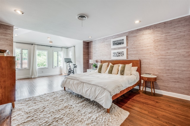 bedroom with hardwood / wood-style floors