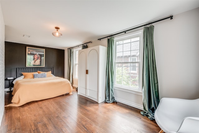 bedroom featuring wood-type flooring