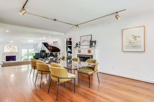 interior space with light wood-type flooring and track lighting