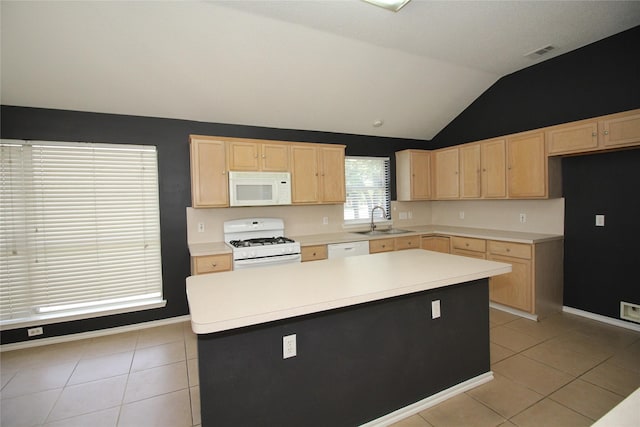 kitchen featuring white appliances, light brown cabinetry, a center island, and sink