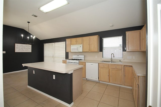 kitchen featuring pendant lighting, sink, white appliances, light tile patterned floors, and a kitchen island