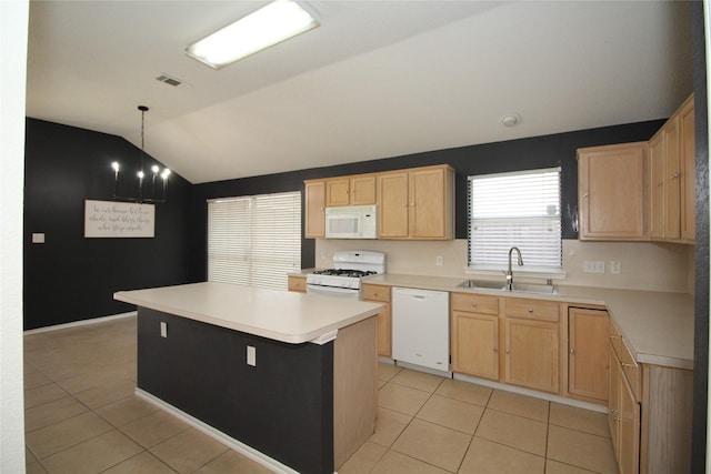 kitchen with sink, white appliances, a center island, light tile patterned flooring, and decorative light fixtures