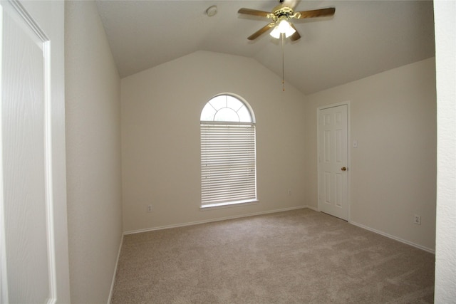 unfurnished room with lofted ceiling, light colored carpet, and ceiling fan