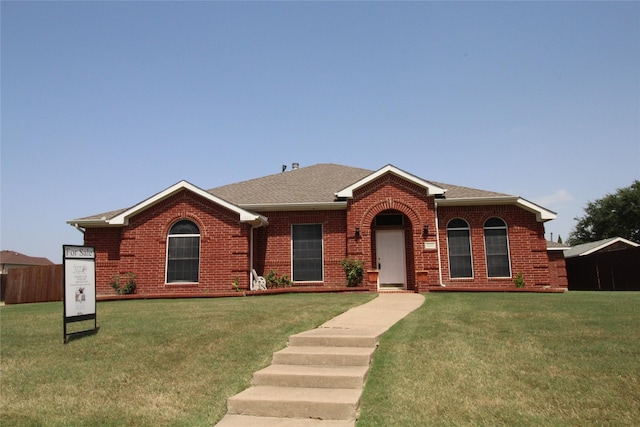 single story home with a front yard