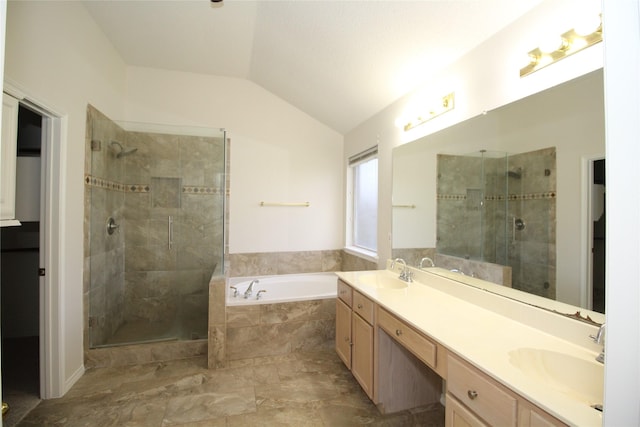 bathroom featuring lofted ceiling, vanity, and separate shower and tub