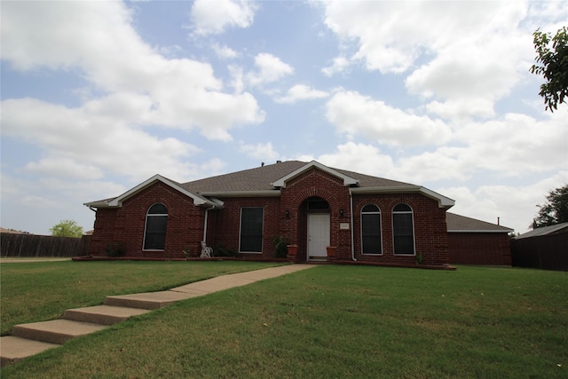 ranch-style home with a front yard