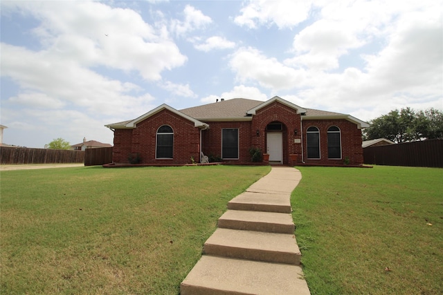 single story home with a front yard