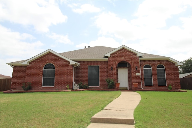 ranch-style house with a front lawn