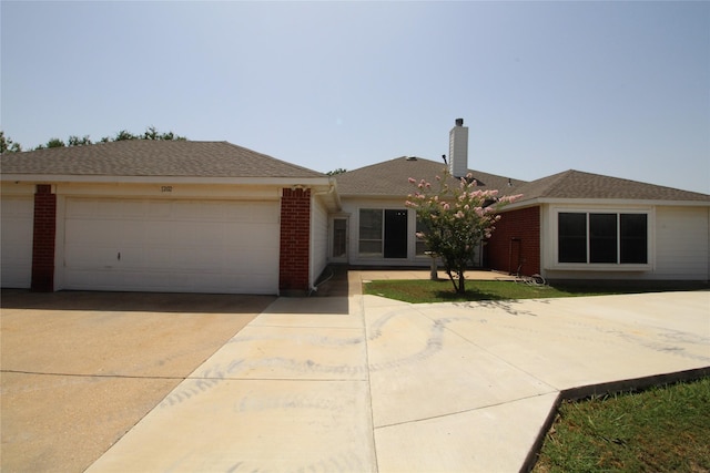 ranch-style house featuring a garage