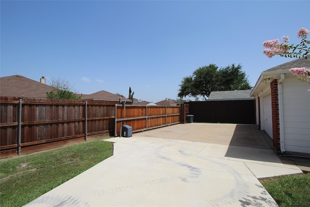 view of patio featuring a garage