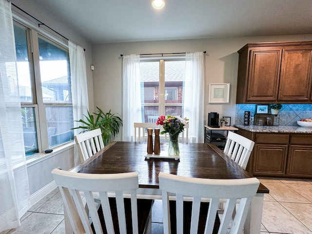 dining room featuring light tile patterned floors