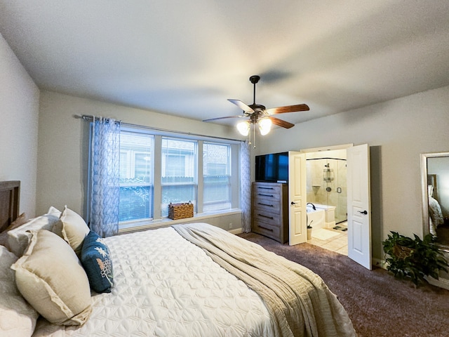 tiled bedroom featuring connected bathroom and ceiling fan