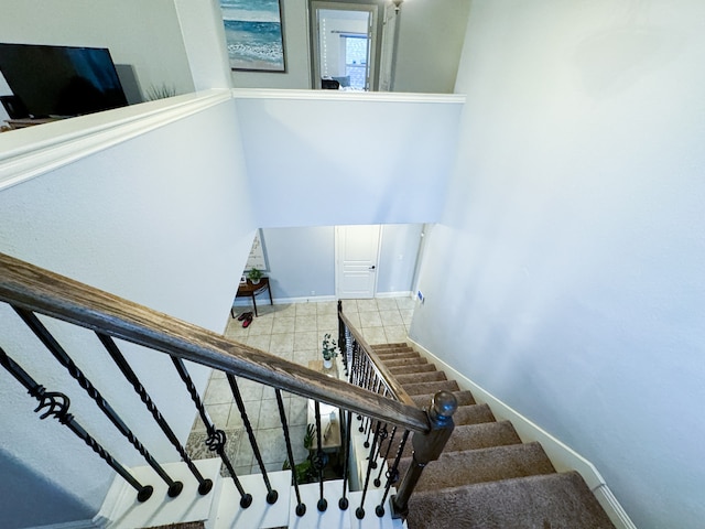 stairs featuring tile patterned floors