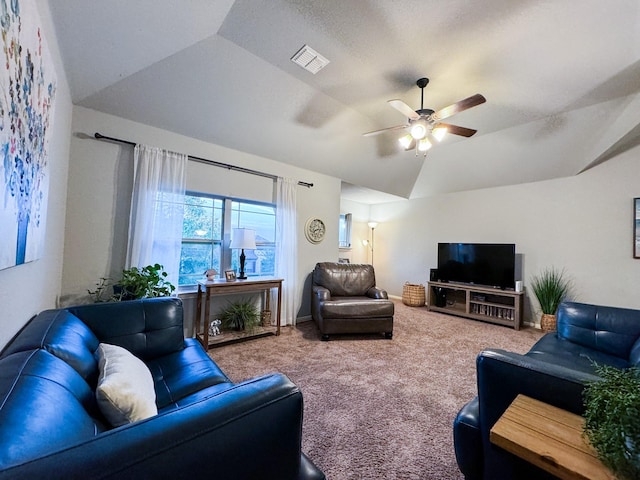 carpeted living room featuring ceiling fan and lofted ceiling