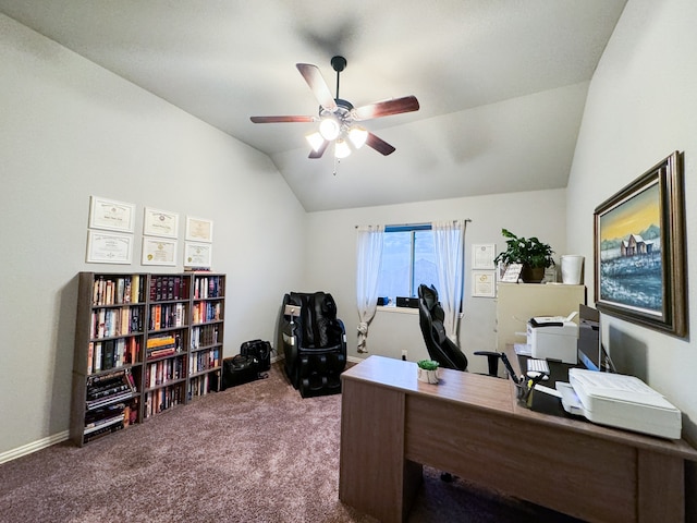 home office featuring vaulted ceiling, carpet, and ceiling fan