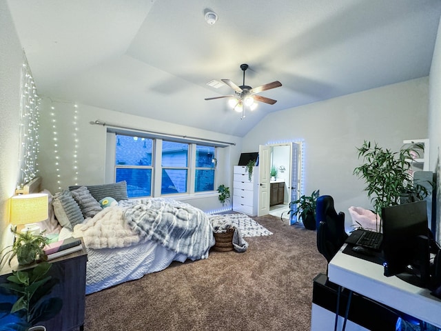 carpeted bedroom featuring vaulted ceiling, connected bathroom, and ceiling fan