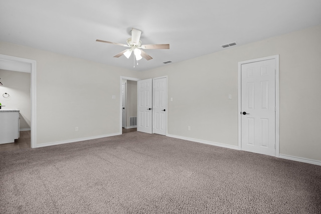 unfurnished bedroom with carpet floors and ceiling fan