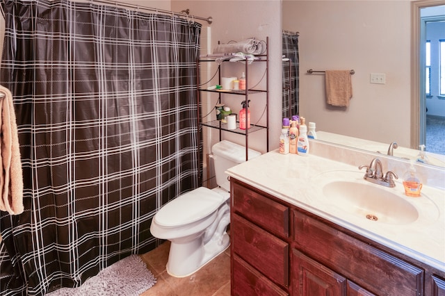 bathroom with tile patterned floors, vanity, and toilet