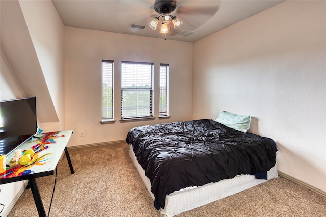 bedroom with light carpet and ceiling fan