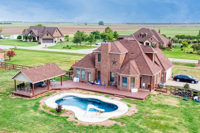 view of pool featuring a wooden deck and a rural view