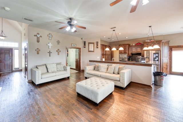 living room with wood-type flooring, sink, and ceiling fan