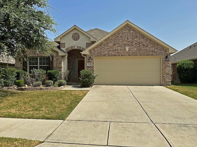 view of front of home featuring a garage and a front lawn