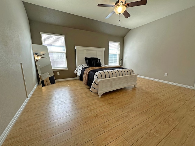 bedroom featuring vaulted ceiling, light hardwood / wood-style flooring, and ceiling fan