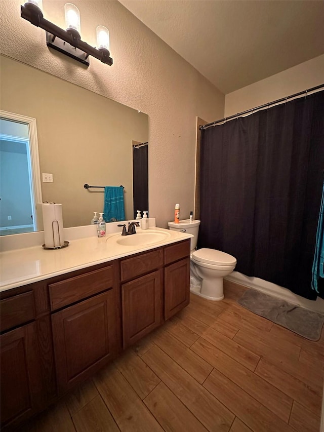 2205 Willow Creek Dr, Little Elm, TX 75068 - bathroom with vanity, toilet, and hardwood / wood-style floors