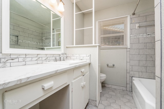 full bathroom with tile patterned flooring, vanity, tasteful backsplash, toilet, and tiled shower / bath