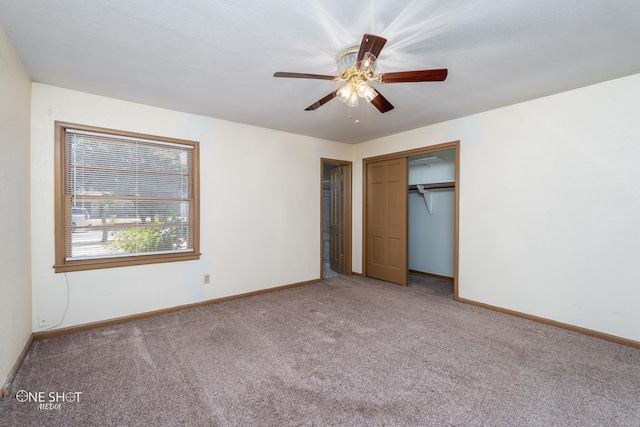 unfurnished bedroom featuring a closet, ceiling fan, and carpet