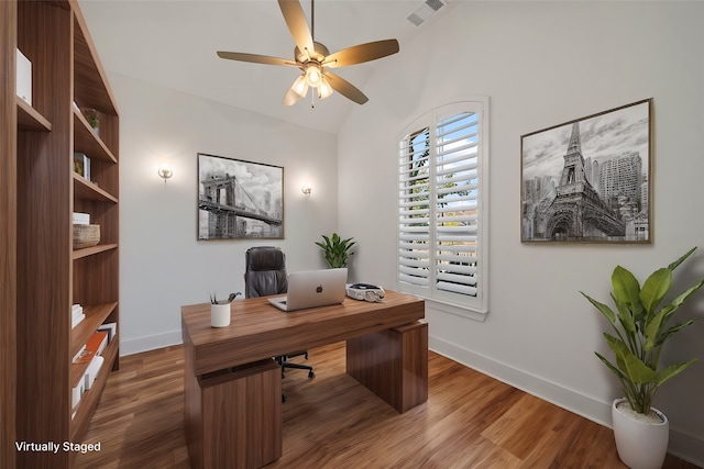 office featuring ceiling fan, dark hardwood / wood-style floors, and vaulted ceiling