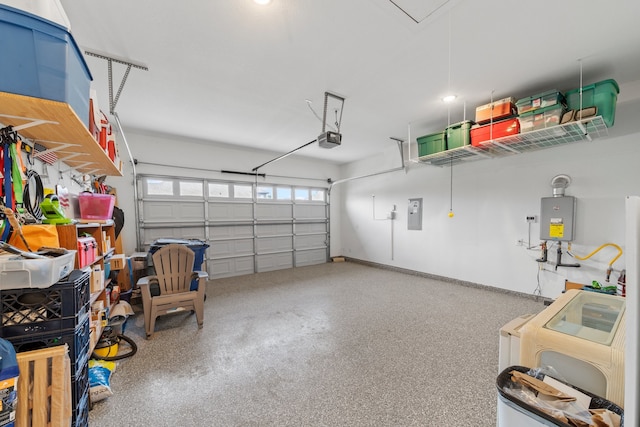 garage with a garage door opener, electric panel, and water heater