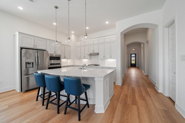 living room with light hardwood / wood-style floors and ceiling fan