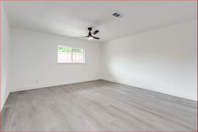 spare room featuring ceiling fan and light hardwood / wood-style flooring