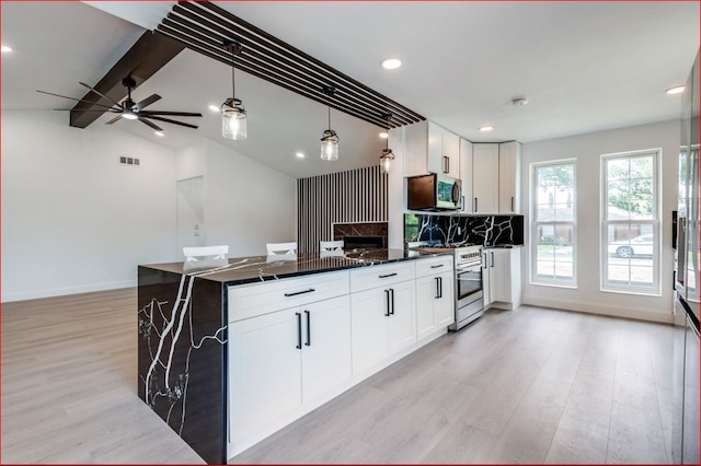 kitchen with light hardwood / wood-style flooring, white cabinetry, ceiling fan, and stainless steel appliances