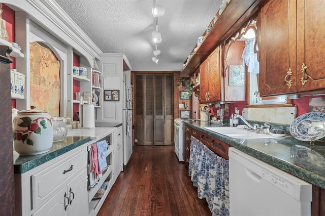 kitchen with white cabinetry, rail lighting, a textured ceiling, white dishwasher, and sink