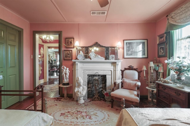 interior space featuring a fireplace, ceiling fan, and hardwood / wood-style flooring