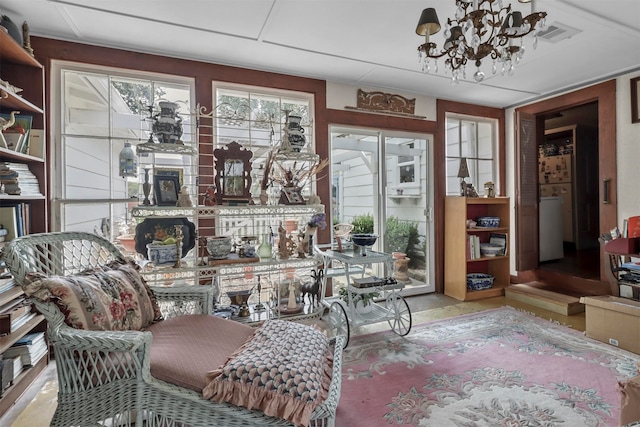 living area with a chandelier