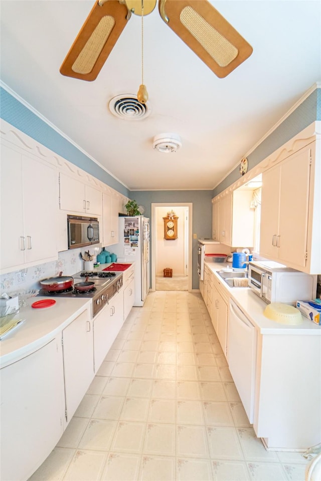 kitchen with white cabinetry, crown molding, stainless steel gas cooktop, and dishwasher